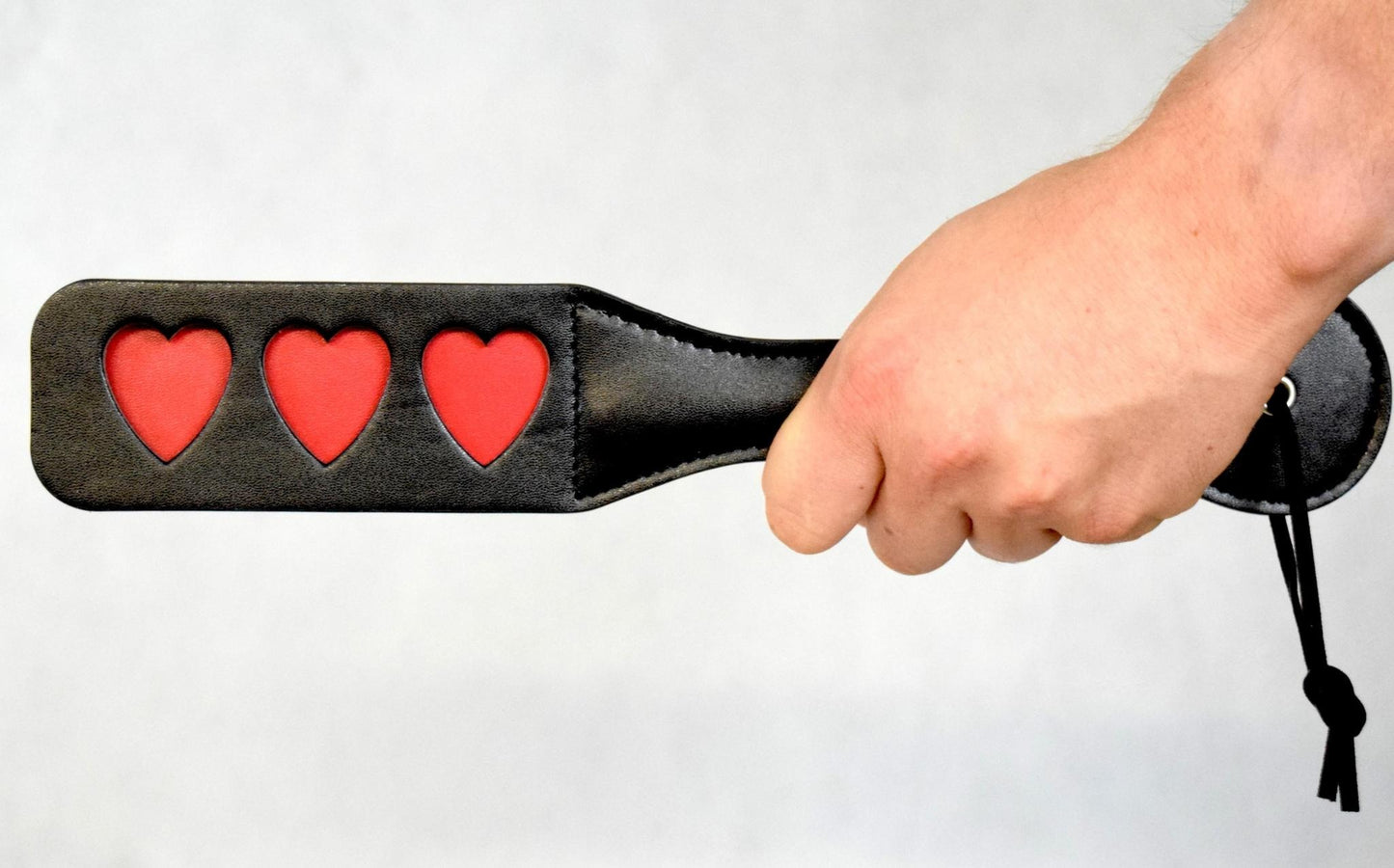 black and red spanking paddle for bondage leather